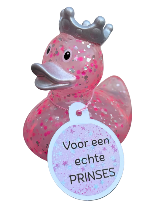 Roze glitterbadeend met zilverkleurige kroon en snavel en een hangtag met de tekst ‘Voor een echte prinses’.