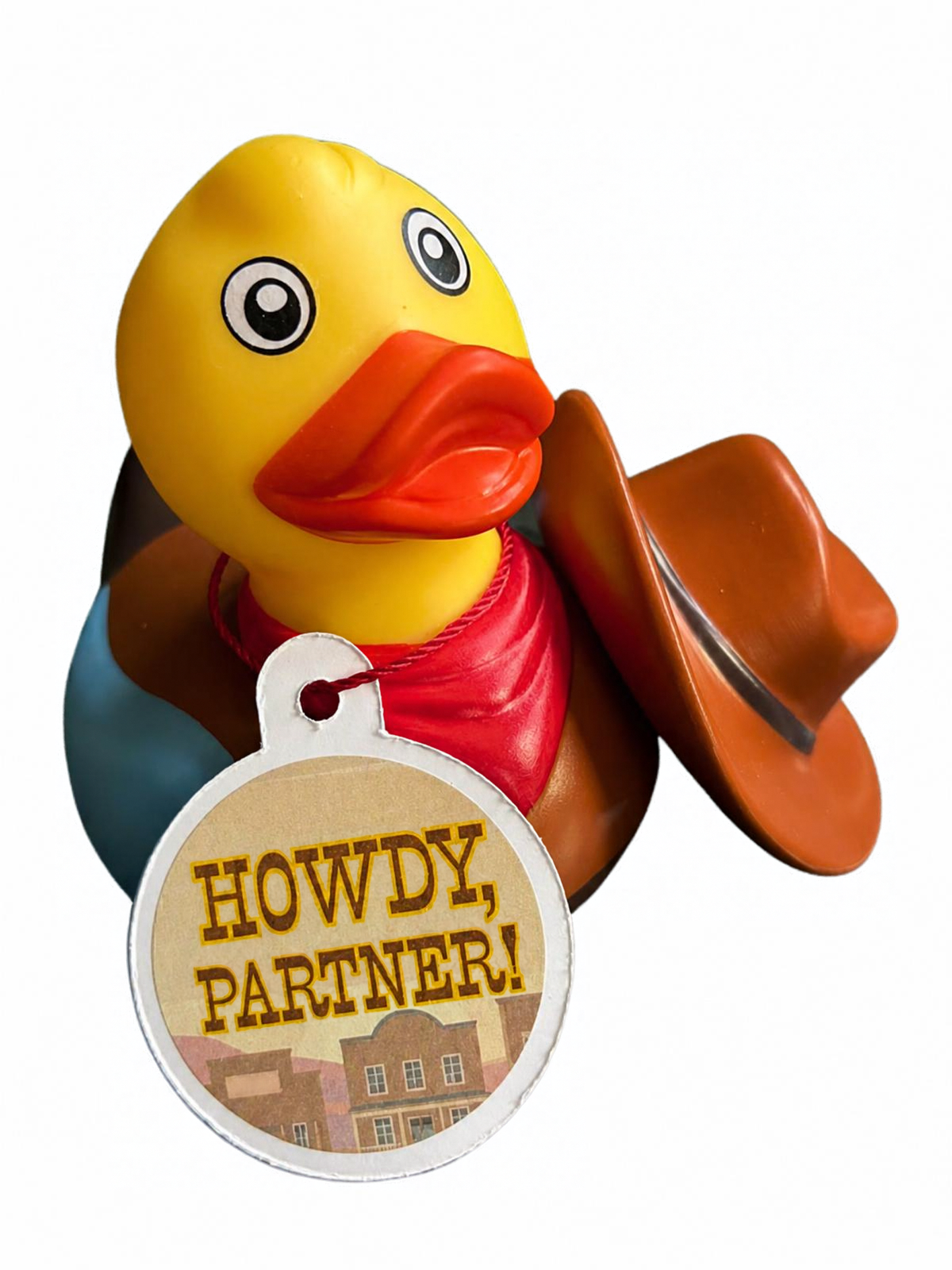 Met hoed naast het hoofd: “Gele cowboybadeend met rode halsdoek, bruine hoed naast het hoofd en een hangtag met de tekst ‘Howdy, partner!’.”