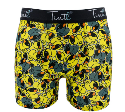 Boxershort met een patroon van gele en blauwgrijze badeenden met zwarte zonnebrillen en oranje snavels, en een zwarte tailleband met het Tintl-logo.